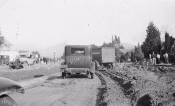 Vintage January 5, 1934 B&W Photo - Commercial Business Trucks Driving In Mud