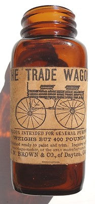 Vintage / Antique ORANGE Glass WE TRADE WAGON Ad On BOTTLE